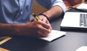 Man writing down a list
