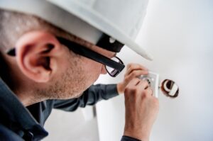 An electrician fixing a socket