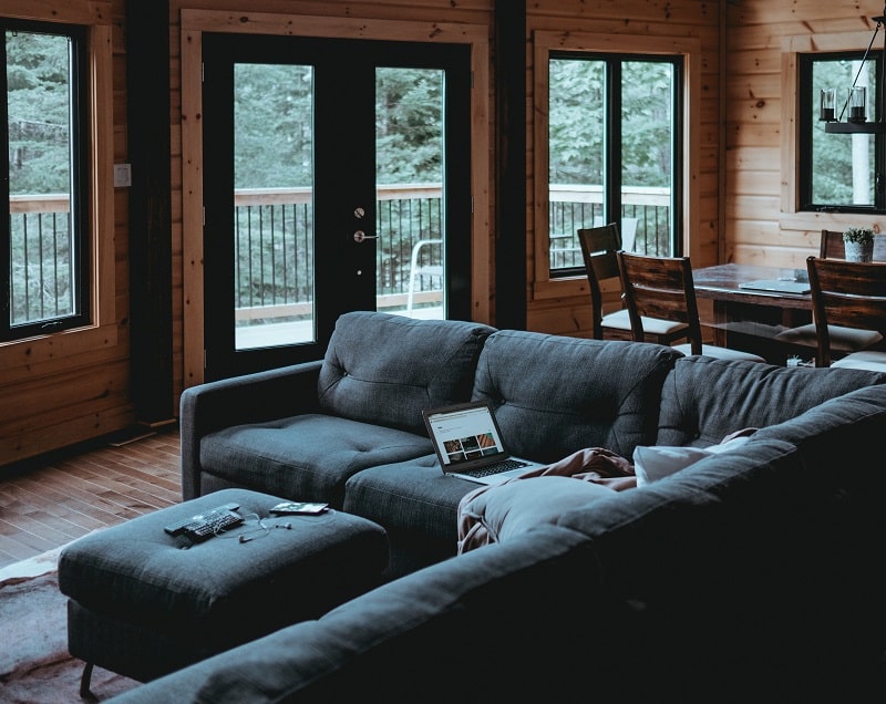 A cozy living room in a wooden cabin