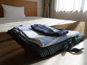 Folded clothes on a bed