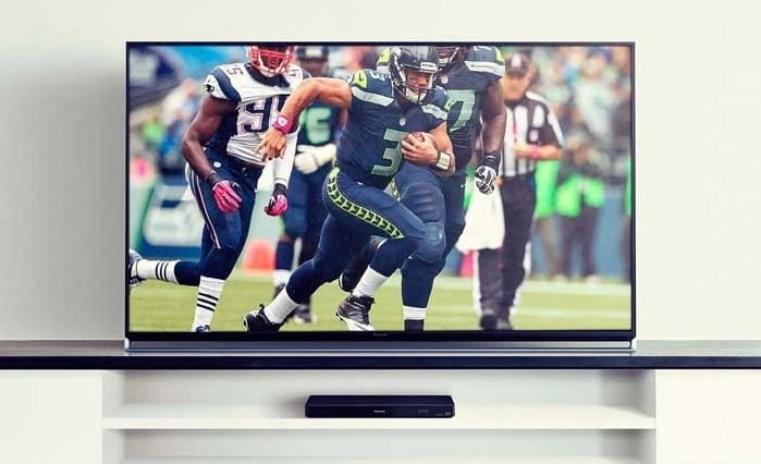 A TV displaying an American football match