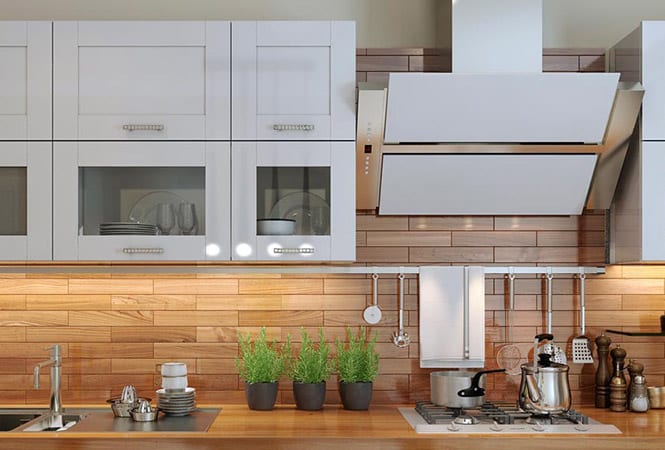 A kitchen with white and wooden finishes