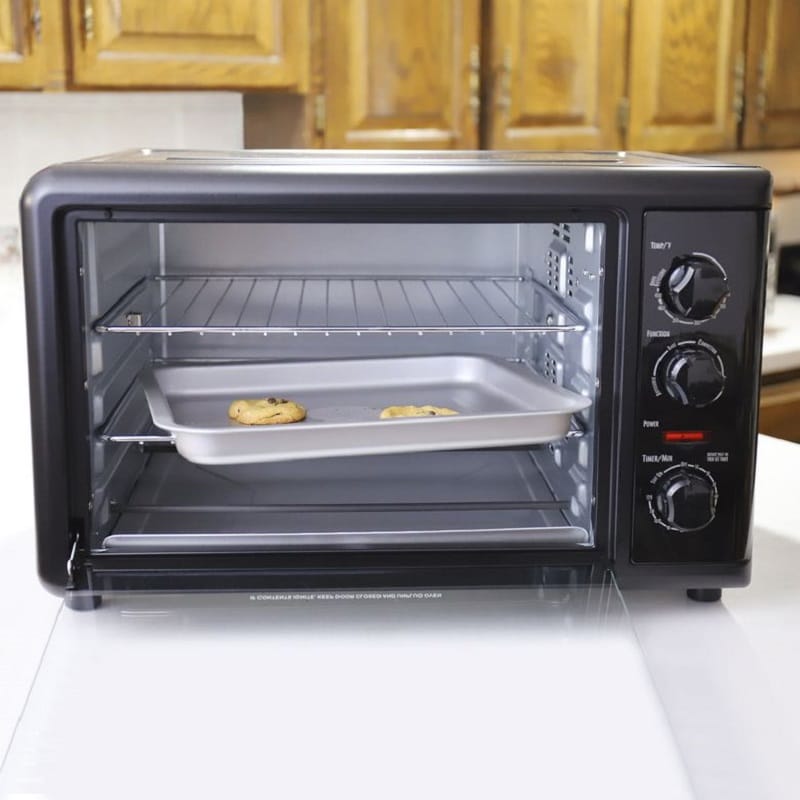 A countertop oven on the top of a kitchen counter.
