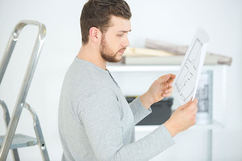 A man reading a user manual