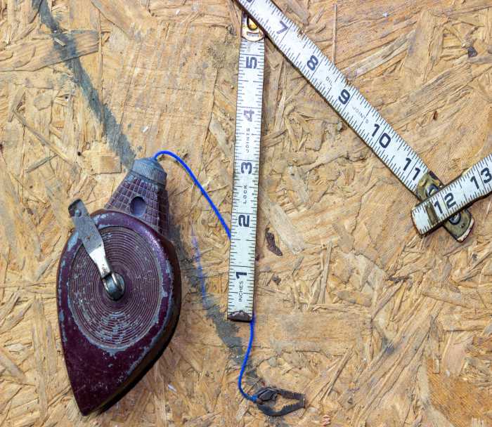 Measuring tape on top of Plywood