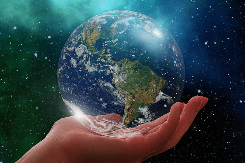A hand holding earth