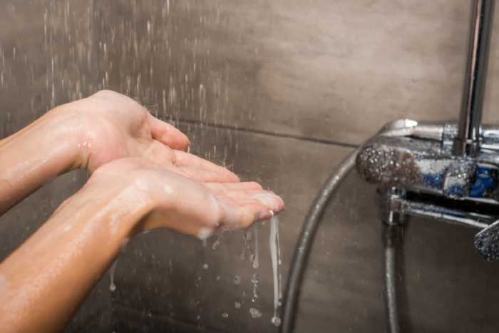 water running down on hands