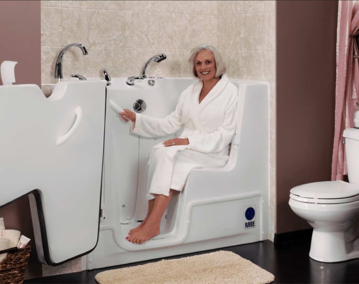 Walk-in bathtub with a female elderly.