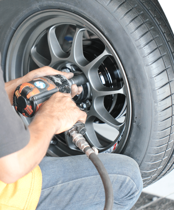 man holding a corded impact wrench