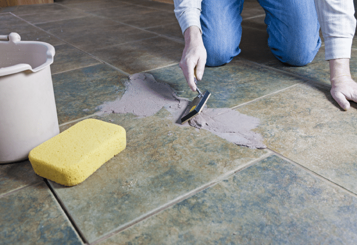 male using epoxy grout for floor tiles