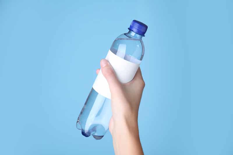 Use a water bottle label as plumber's tape alternative