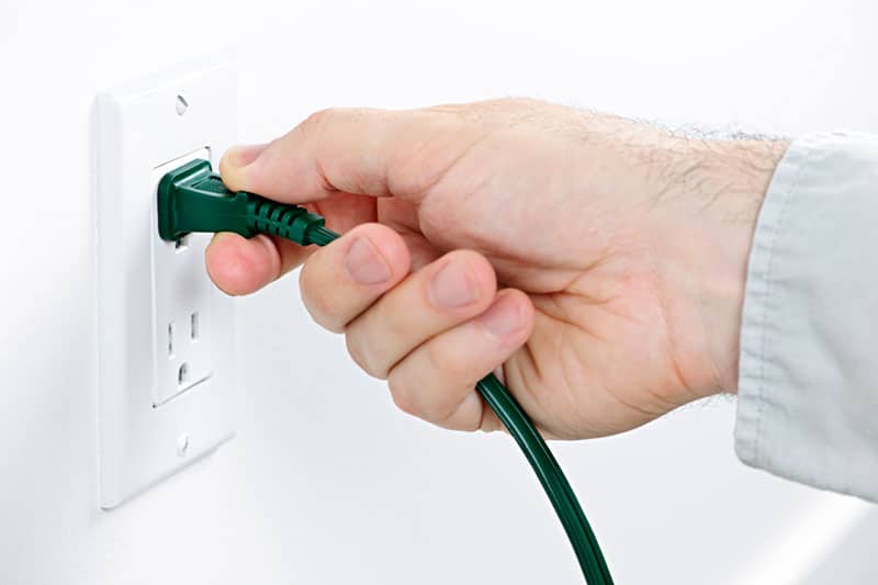 Checking plug cord is in socket correctly