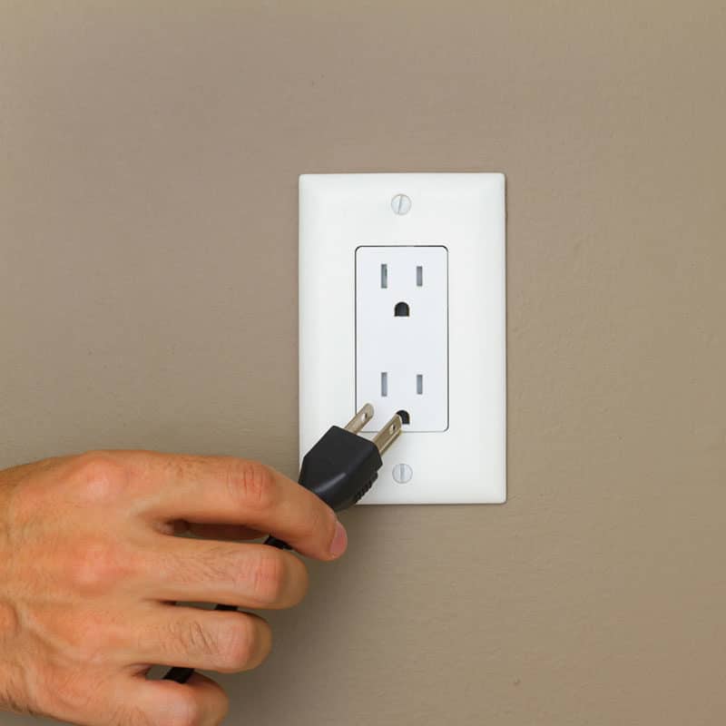 a wall outlet with a power cord