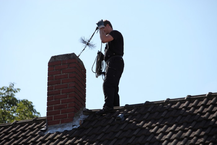 male checking Chimney 