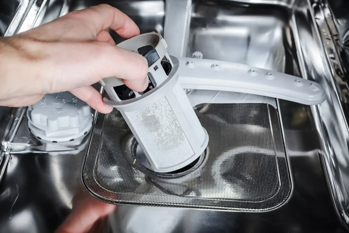 Clean dishwasher filter to prevent standing water