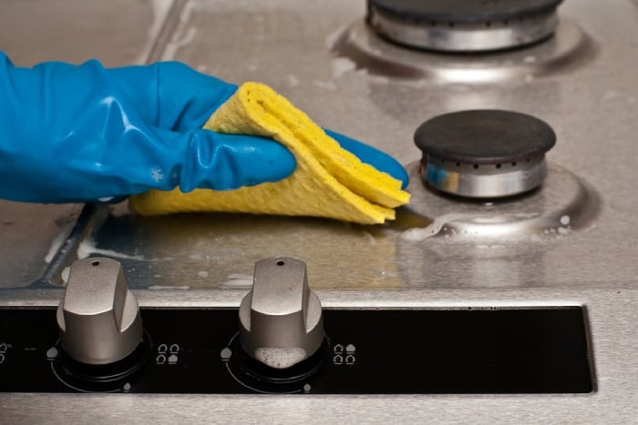 Close up of cleaning a burner/stove