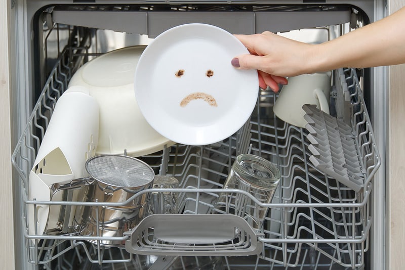 A dish with a sad face drawing