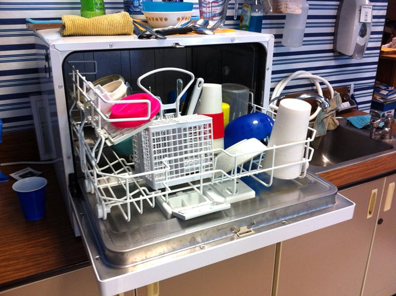 A small dishwasher fully loaded