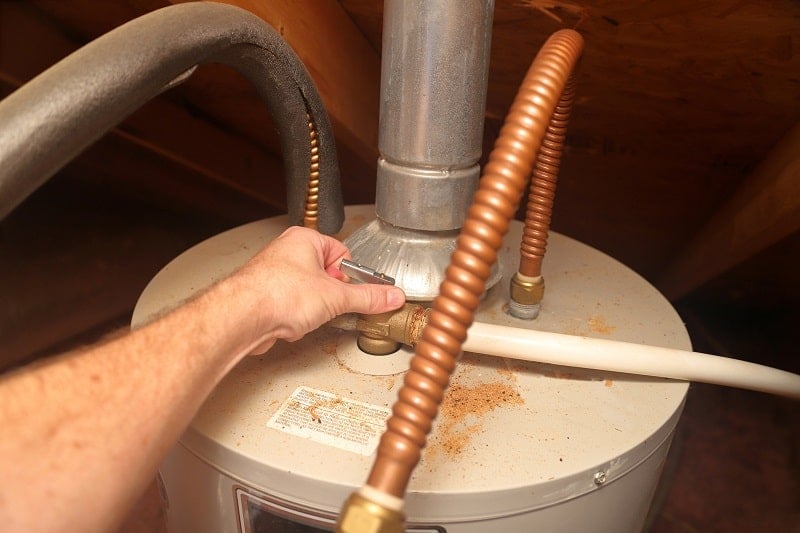 A hand releaseing the temperature pressure valve