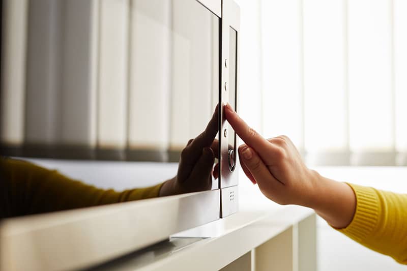 Microwave light won't turn off due to a jammed button