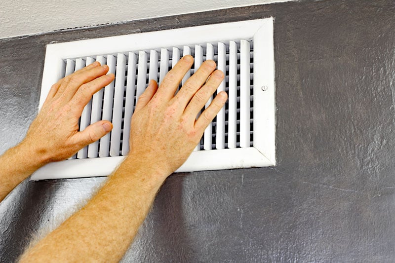 checking for airflow in a wall vent