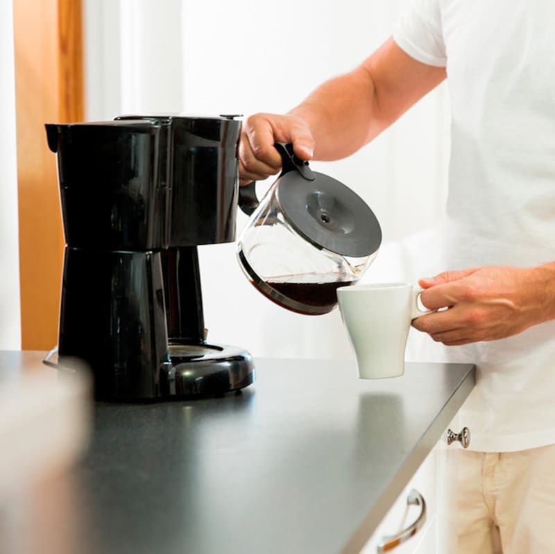 Man Serving Coffee Cup