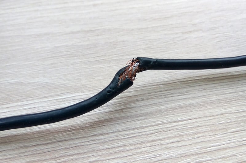 Black power cord damaged
