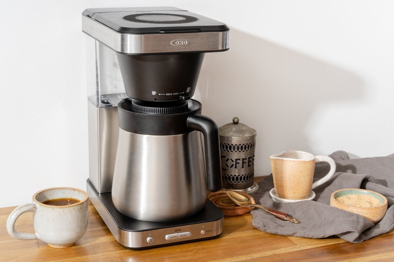 Deluxe Coffe Maker With a cup of coffee