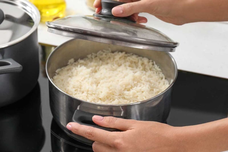 Cooking rice on boiling pot