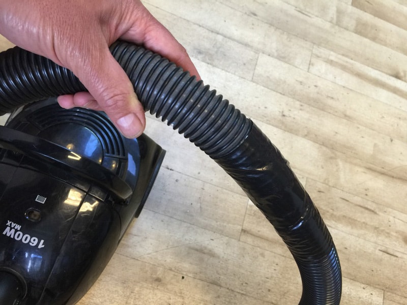Vacuum hose repaired with duct tape