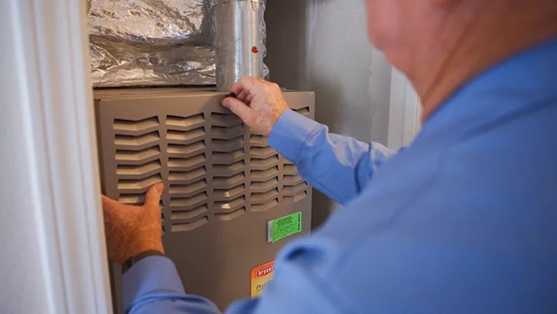 Person in front of furnace 