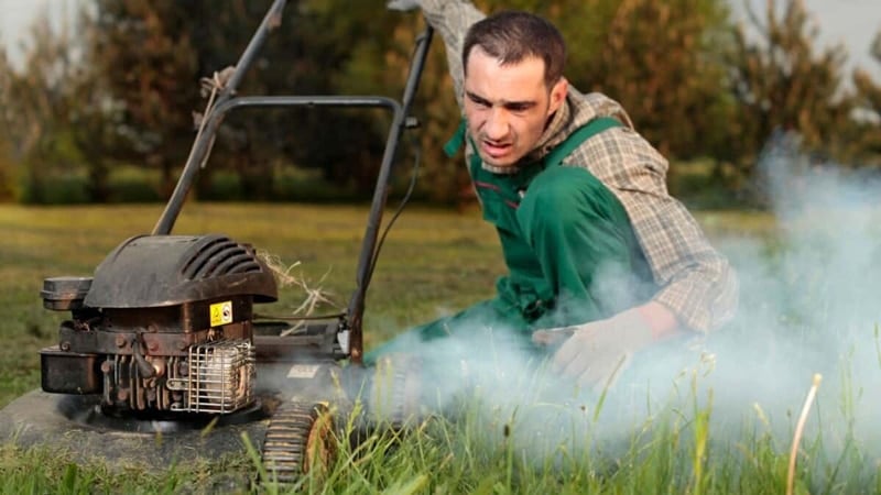 Man inspection lawn mower