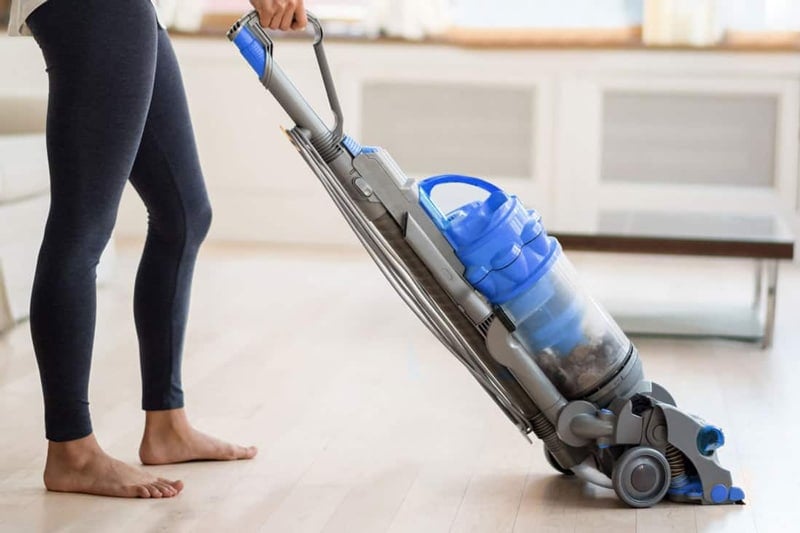 Woman Using Dyson Vacuum