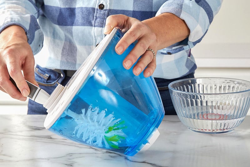 Hands Cleanning Water Tank From Humidifier