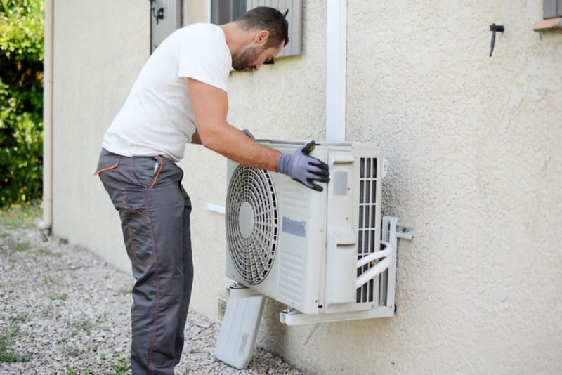 Man Installing Air Conditioner Blower Motor