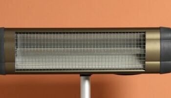 Isolated Electric Heater behind orange wall