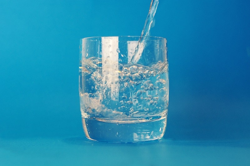 pouring water in a glass