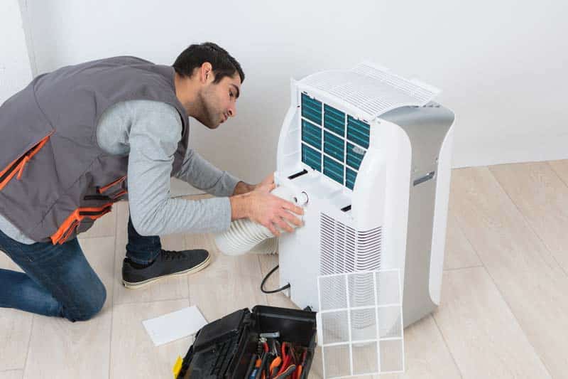 professional technician installing a industrial dehumidifier