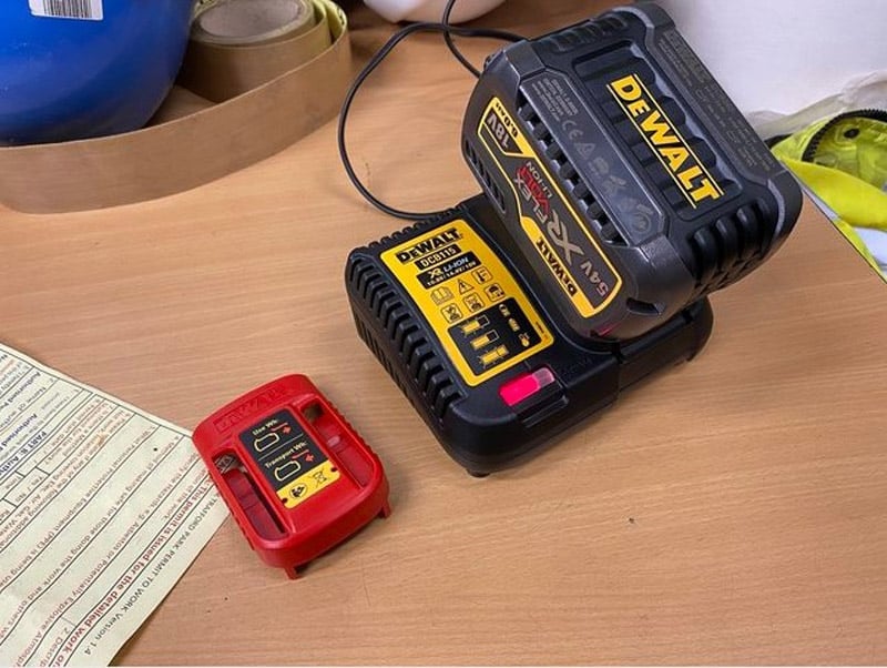 DeWalt Battery Charger With Battery Connected And Red Light On
