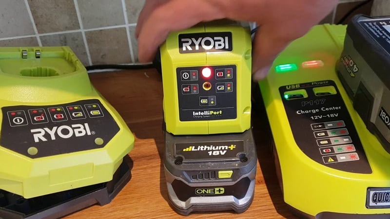Three Ryobi Chargers With Lights ON