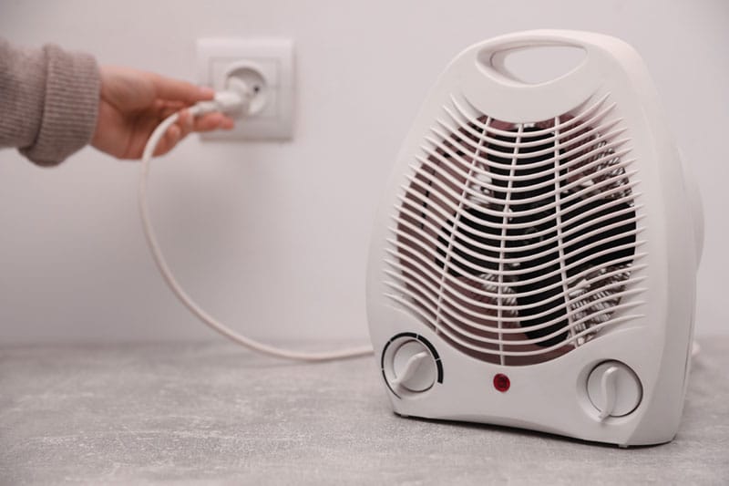 plug space heater into wall outlet