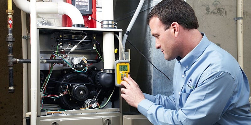 HVAC Technician Fixing Furnace Electrical Problems