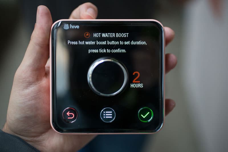 Man Hand Holding Hive Thermostat