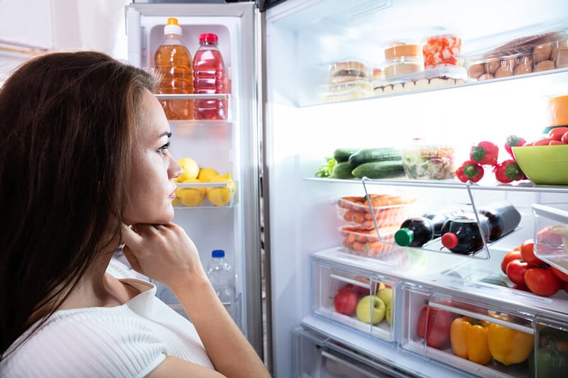 staring inside refrigerator