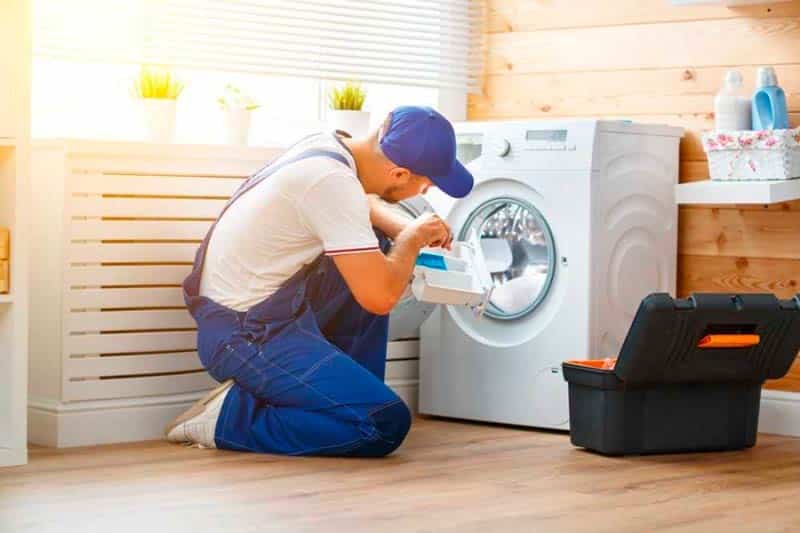 A technician Fixing Washer