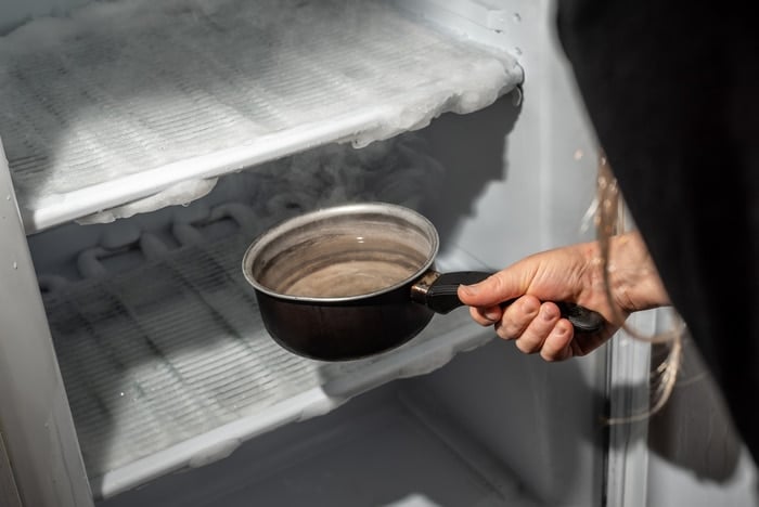 Fill a bowl with boiling water to speed up the defrosting process