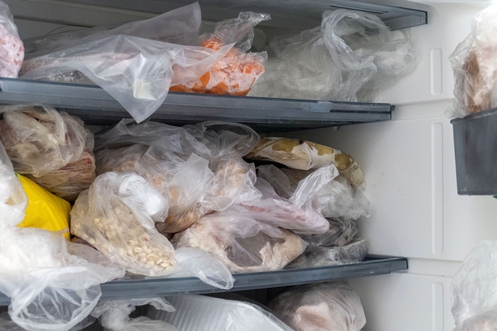 A freezer compartment full of frozen groceries