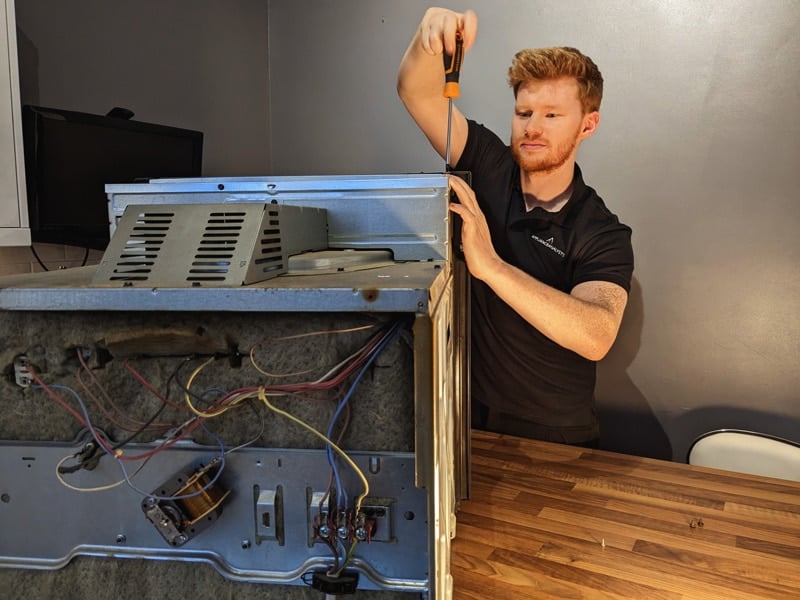Craig Anderson Repairing Appliance