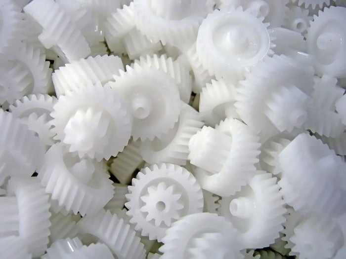 A bunch of white plastic gears