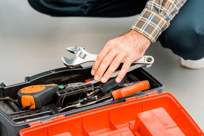 A man with an open toolbox